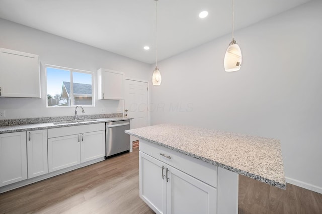 1559 Obetz Ave, Obetz, OH 43207 - kitchen with a sink, white cabinetry, stainless steel dishwasher, light wood-type flooring, and recessed lighting