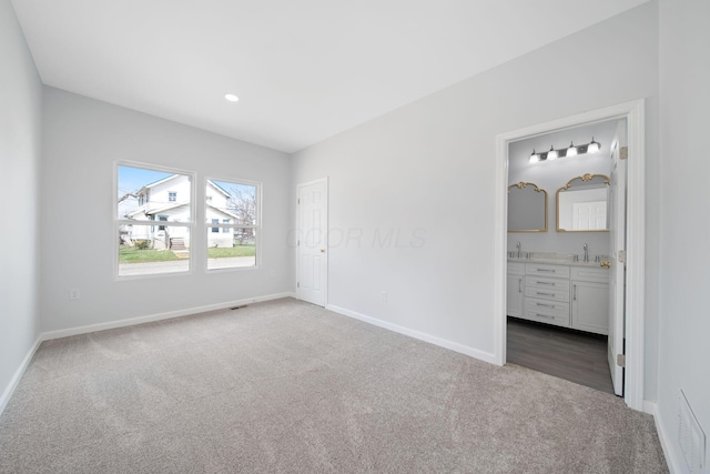 1559 Obetz Ave, Obetz, OH 43207 - unfurnished bedroom with baseboards, visible vents, carpet floors, and a sink