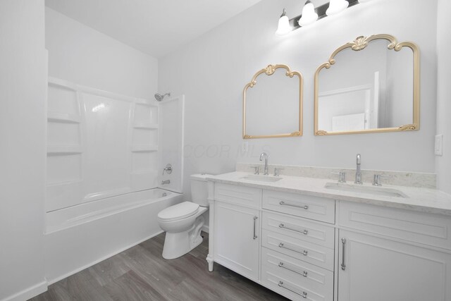 1559 Obetz Ave, Obetz, OH 43207 - bathroom with double vanity, a sink, toilet, and wood finished floors
