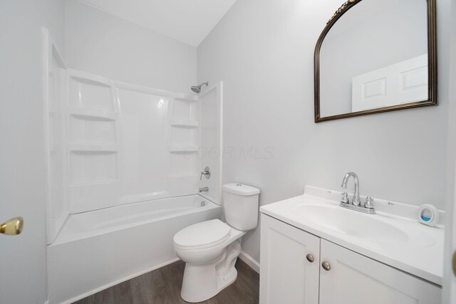 1559 Obetz Ave, Obetz, OH 43207 - bathroom featuring wood finished floors, toilet, vanity, and shower / bathtub combination