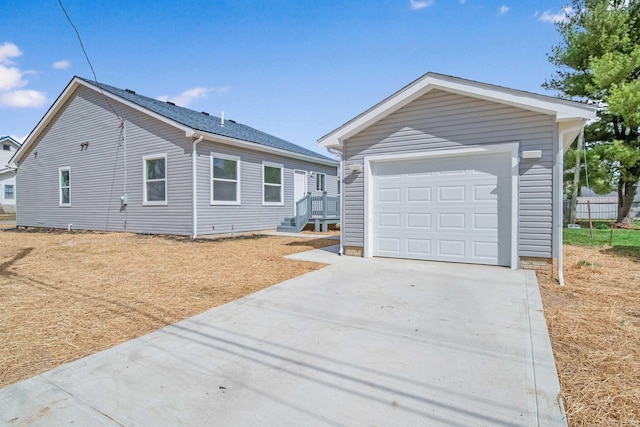1559 Obetz Ave, Obetz, OH 43207 - view of front of property featuring an outdoor structure, a garage, and concrete driveway