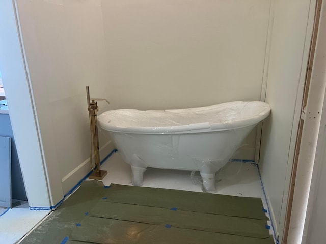 bathroom with a freestanding tub