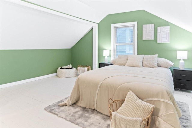 bedroom featuring lofted ceiling