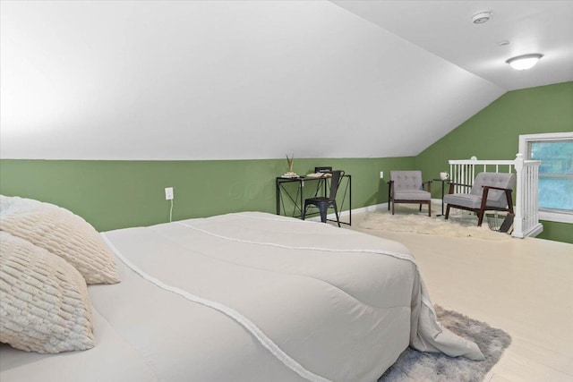 bedroom featuring lofted ceiling