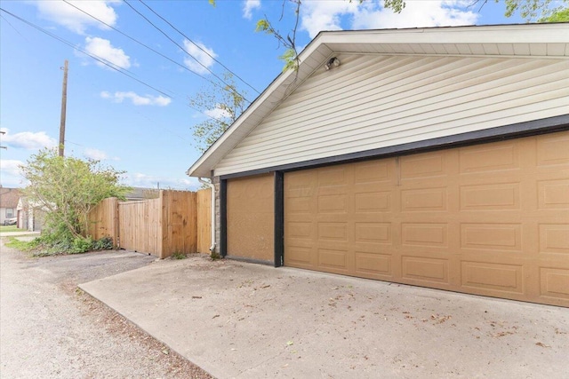 garage with fence