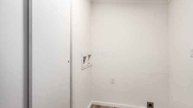 washroom with washer hookup, wood finished floors, laundry area, and hookup for an electric dryer