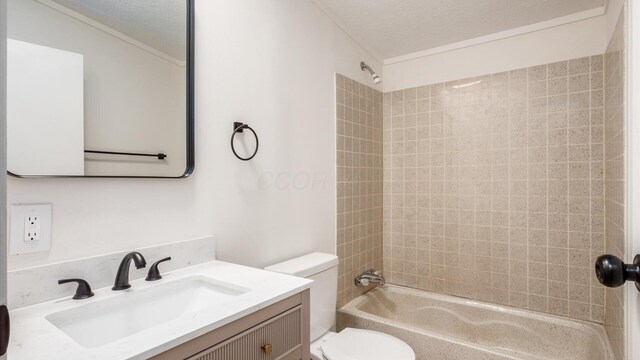 bathroom featuring toilet, vanity, bathing tub / shower combination, and a textured ceiling