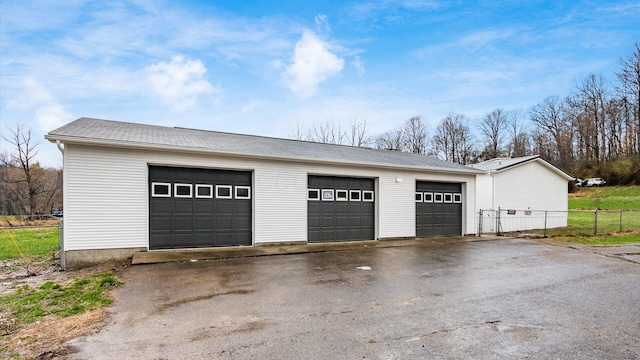 detached garage with fence