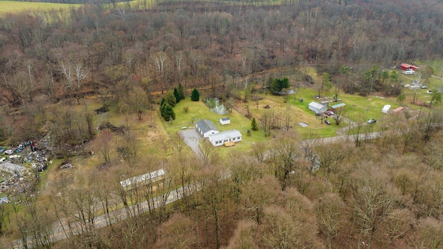 birds eye view of property featuring a rural view and a forest view
