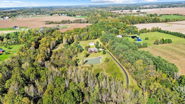 birds eye view of property with a rural view