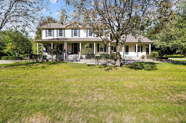view of front of home with covered porch and a front yard