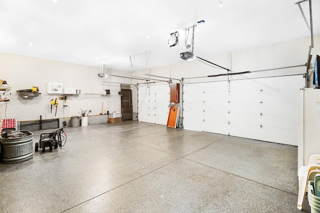 garage featuring a garage door opener