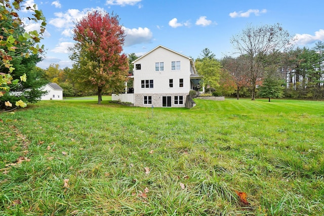 rear view of house with a lawn