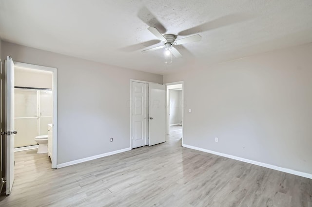 3104 Lewis Rd, Columbus, OH 43207 - unfurnished bedroom featuring light wood-type flooring, ensuite bathroom, and a ceiling fan
