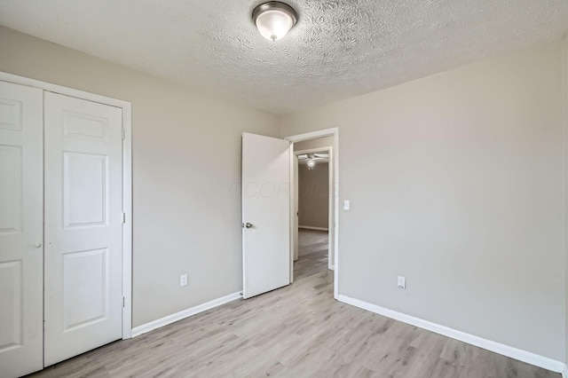 3104 Lewis Rd, Columbus, OH 43207 - unfurnished bedroom with light wood-type flooring and a textured ceiling