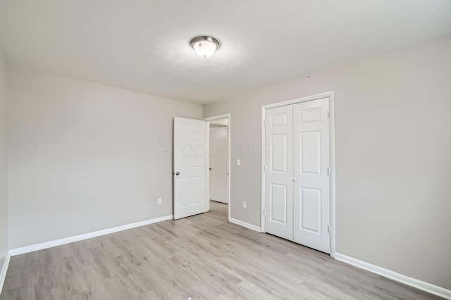 3104 Lewis Rd, Columbus, OH 43207 - unfurnished bedroom with light wood finished floors and a closet