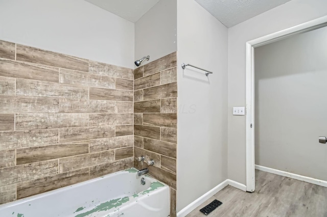 3104 Lewis Rd, Columbus, OH 43207 - bathroom with shower / tub combination and wood finished floors