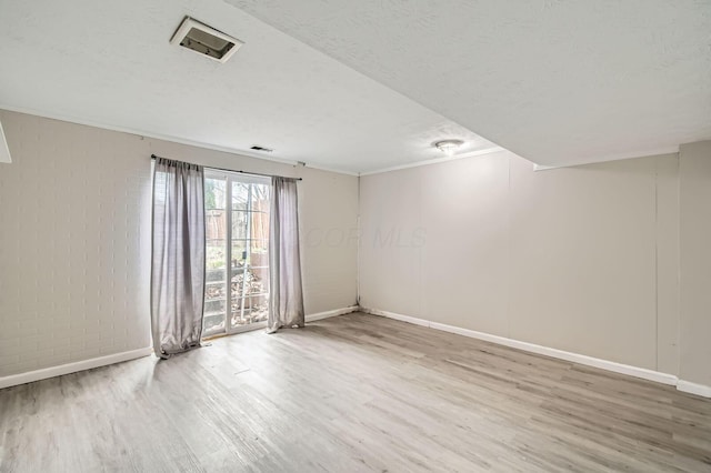 3104 Lewis Rd, Columbus, OH 43207 - unfurnished room with wood finished floors and a textured ceiling