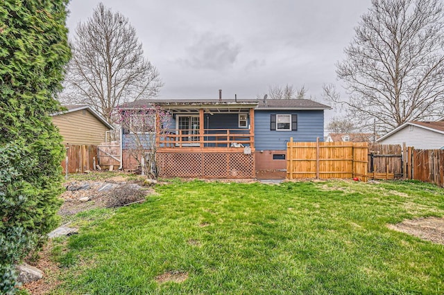 3104 Lewis Rd, Columbus, OH 43207 - rear view of property with a fenced backyard, a wooden deck, and a gate