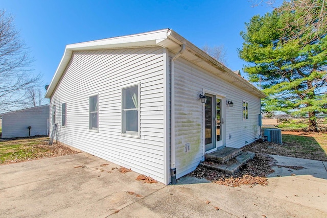 view of home's exterior featuring central AC, a patio area, and entry steps