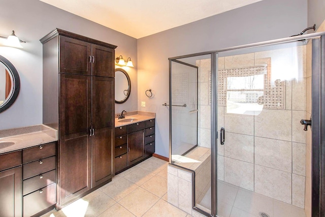 full bathroom with a shower stall, tile patterned flooring, and vanity