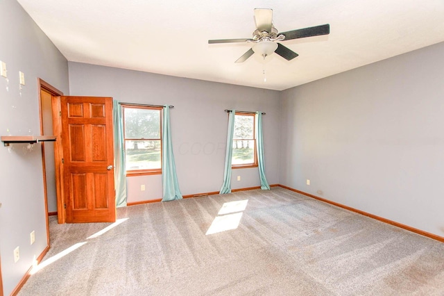 unfurnished bedroom featuring baseboards, carpet floors, and ceiling fan