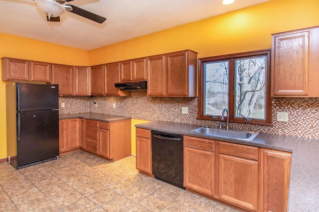 kitchen with ceiling fan, under cabinet range hood, a sink, black appliances, and backsplash