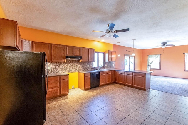 kitchen with brown cabinets, black appliances, ceiling fan, and a sink