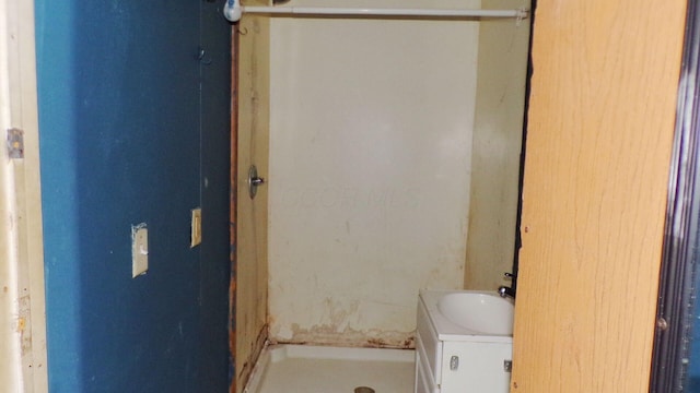 bathroom featuring a stall shower and vanity