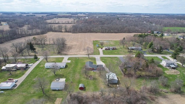 birds eye view of property with a rural view