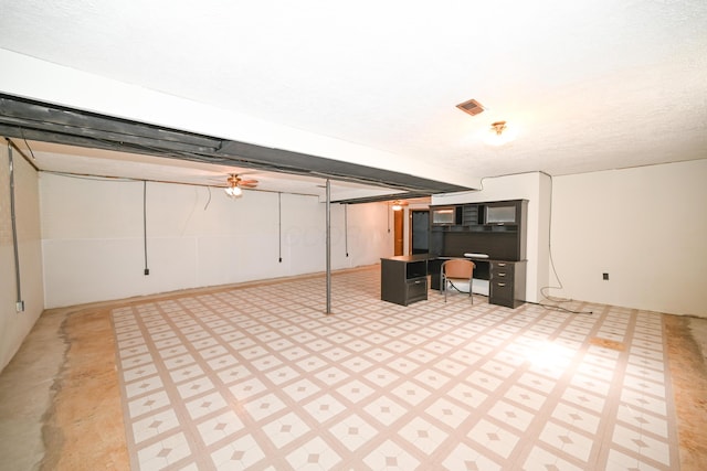 finished below grade area featuring light floors and visible vents