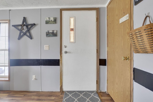 entryway with a textured ceiling