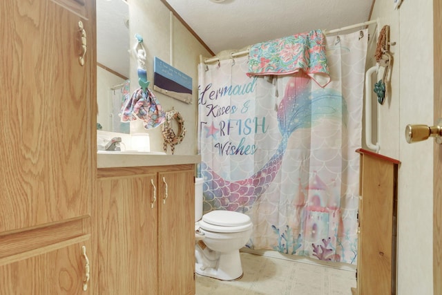 bathroom featuring shower / bath combination with curtain, tile patterned floors, vanity, and toilet