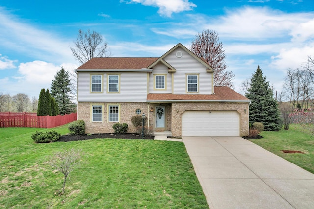 traditional-style house with driveway, a front yard, fence, and brick siding