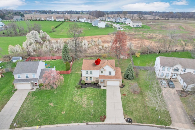 birds eye view of property with a residential view