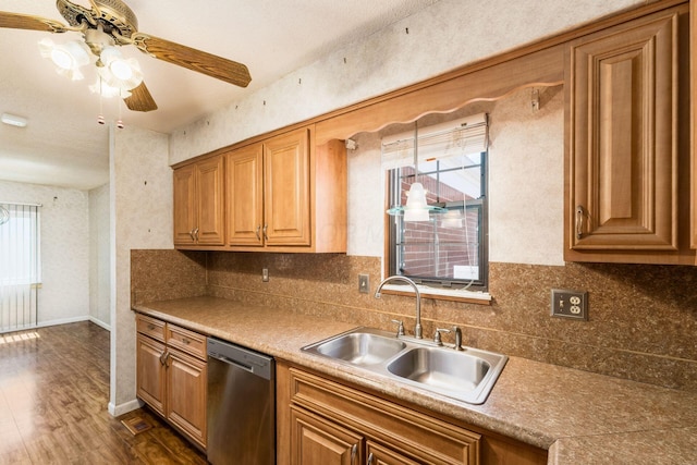 kitchen with ceiling fan, backsplash, dark wood finished floors, dishwasher, and a sink