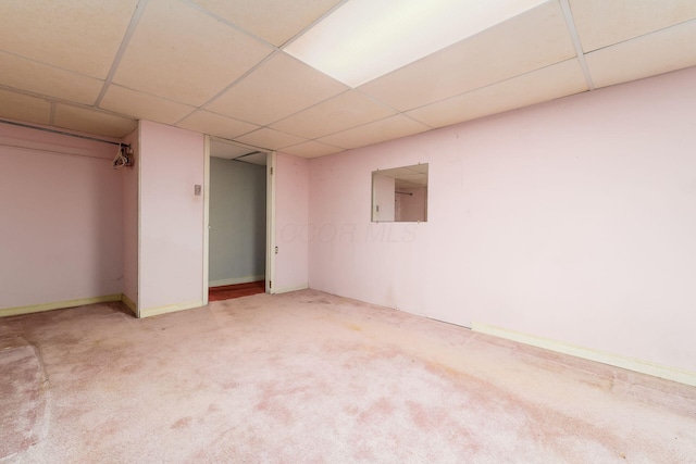 finished below grade area featuring carpet and a drop ceiling