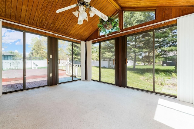 unfurnished sunroom featuring a ceiling fan
