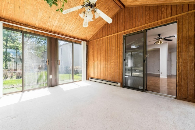 unfurnished sunroom featuring a healthy amount of sunlight and baseboard heating