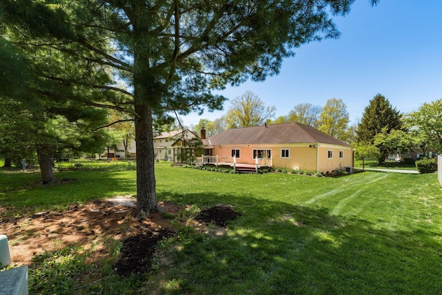 view of yard featuring a deck