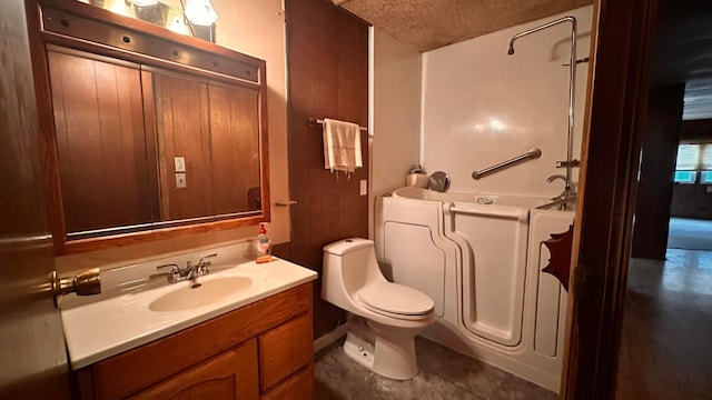 full bathroom featuring toilet, a tub to relax in, vanity, and tile patterned floors