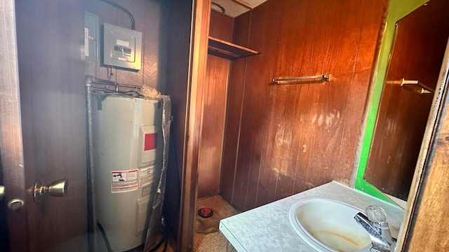 bathroom with water heater and vanity