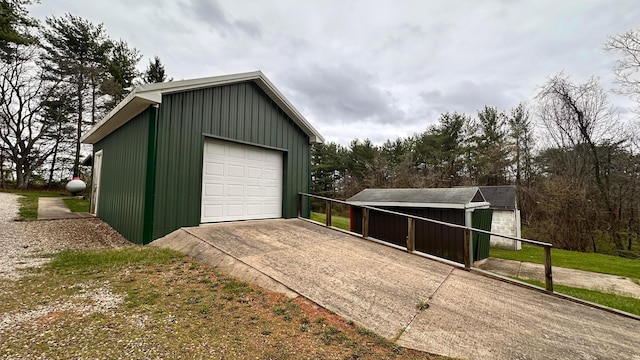 detached garage with concrete driveway