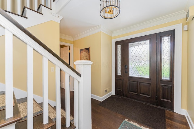 foyer with visible vents, crown molding, stairway, dark wood-style floors, and an inviting chandelier