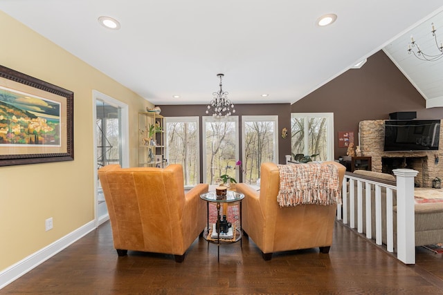 living area featuring baseboards, wood finished floors, recessed lighting, vaulted ceiling, and a notable chandelier