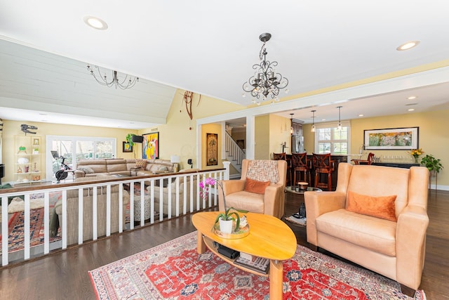 living area featuring stairs, recessed lighting, vaulted ceiling, and wood finished floors