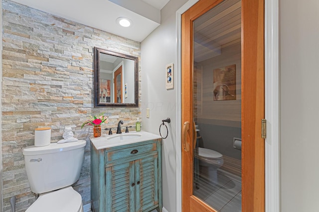 bathroom featuring toilet and vanity
