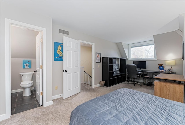carpeted bedroom with connected bathroom, baseboards, and visible vents