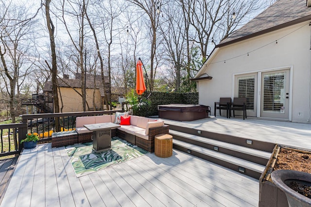 deck with an outdoor hangout area and a hot tub