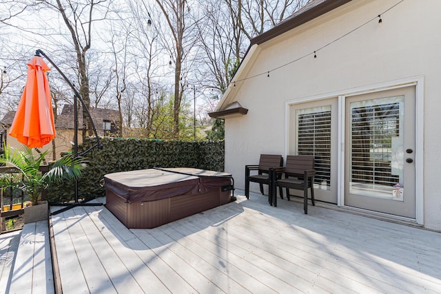 deck with a hot tub